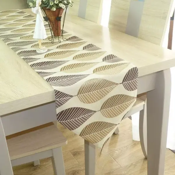111891-0d3ca0.webp Elegant Leaf-Patterned Linen Table Runner